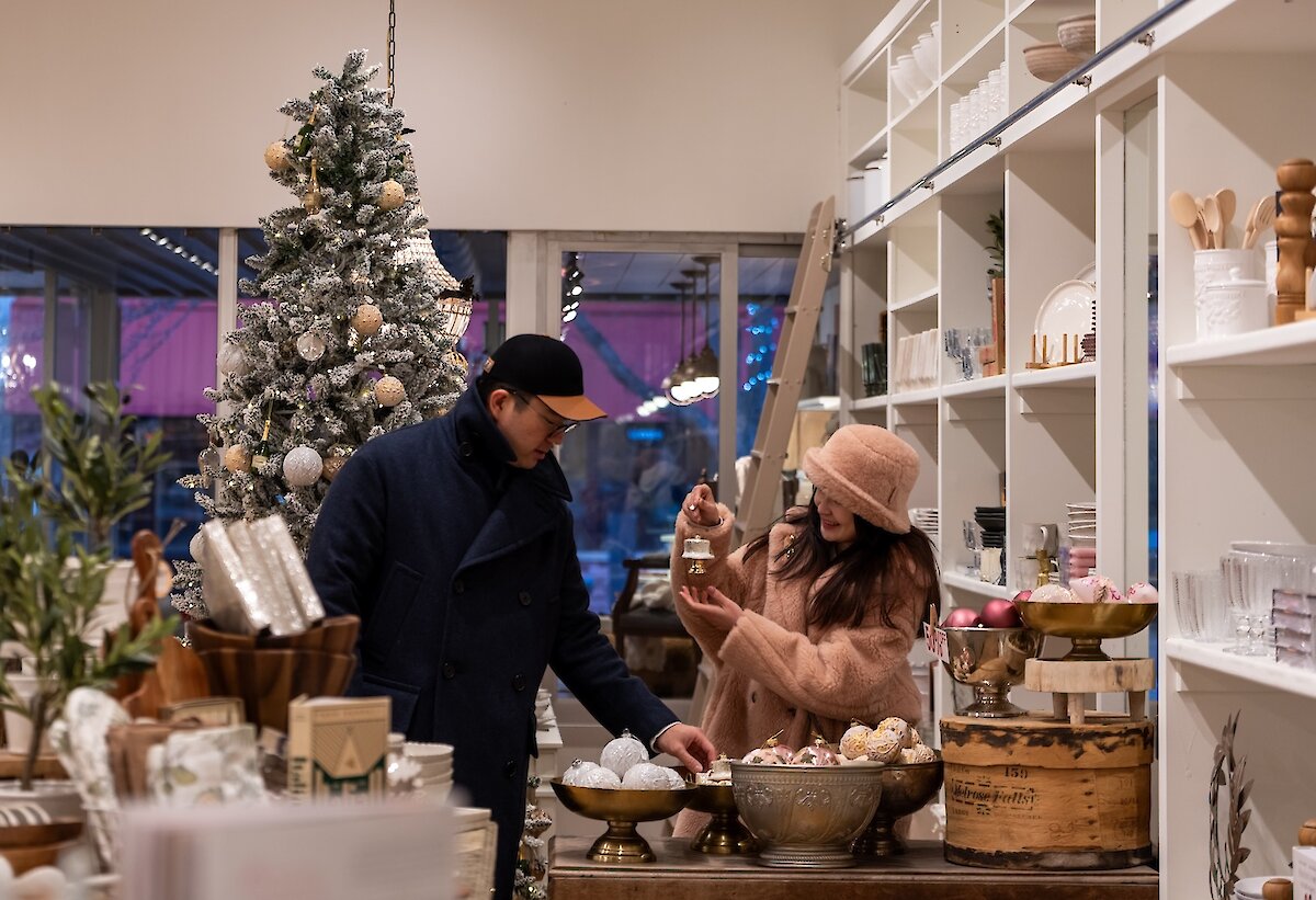 A couple Christmas shopping at Jardines Domaine shop located in downtown Kamloops, BC.