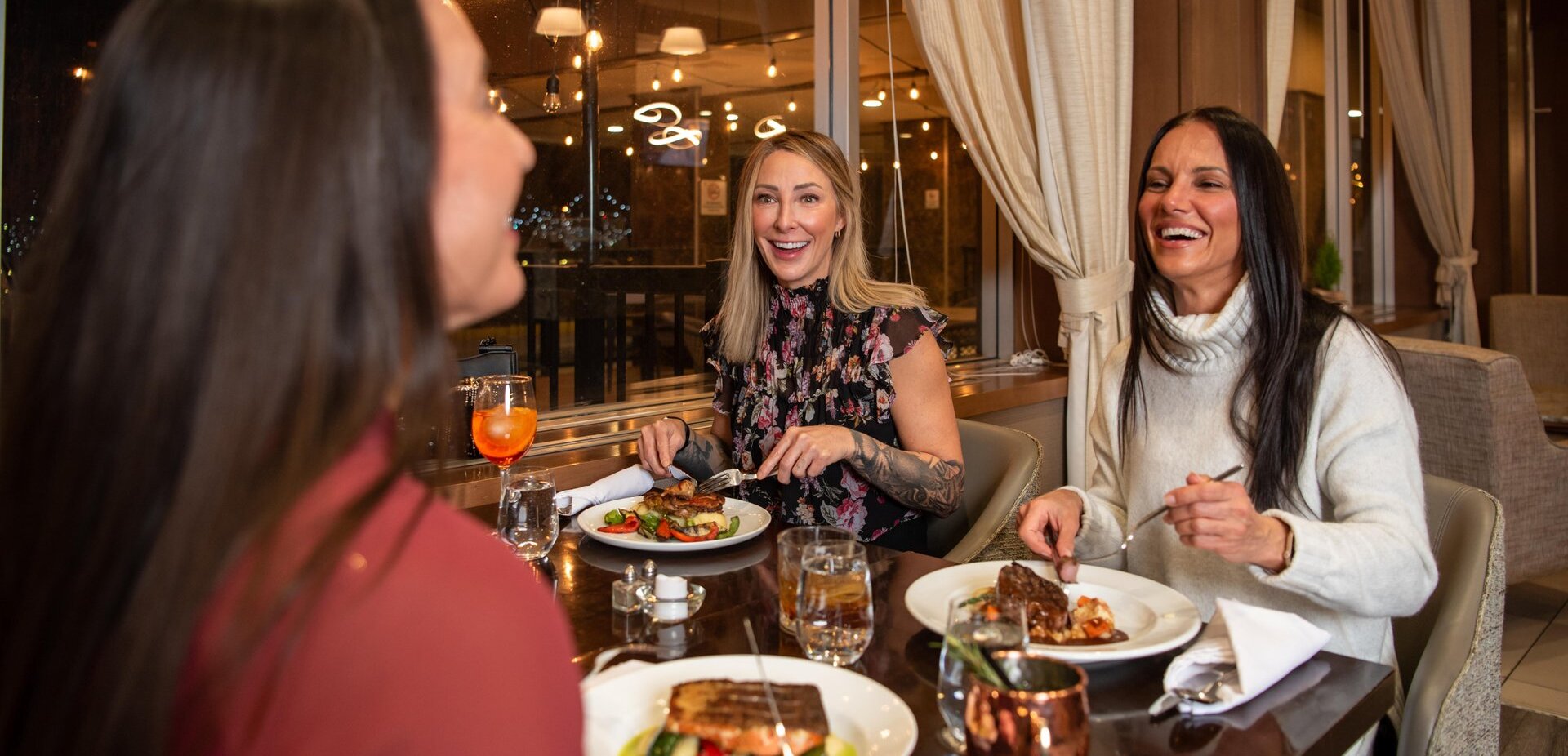 Three woman enjoying their meals at La Condesa during Taste Around in Kamloops, BC.