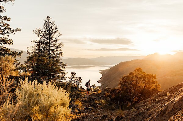 A hiker admiring the fall view in Kamloops, BC.