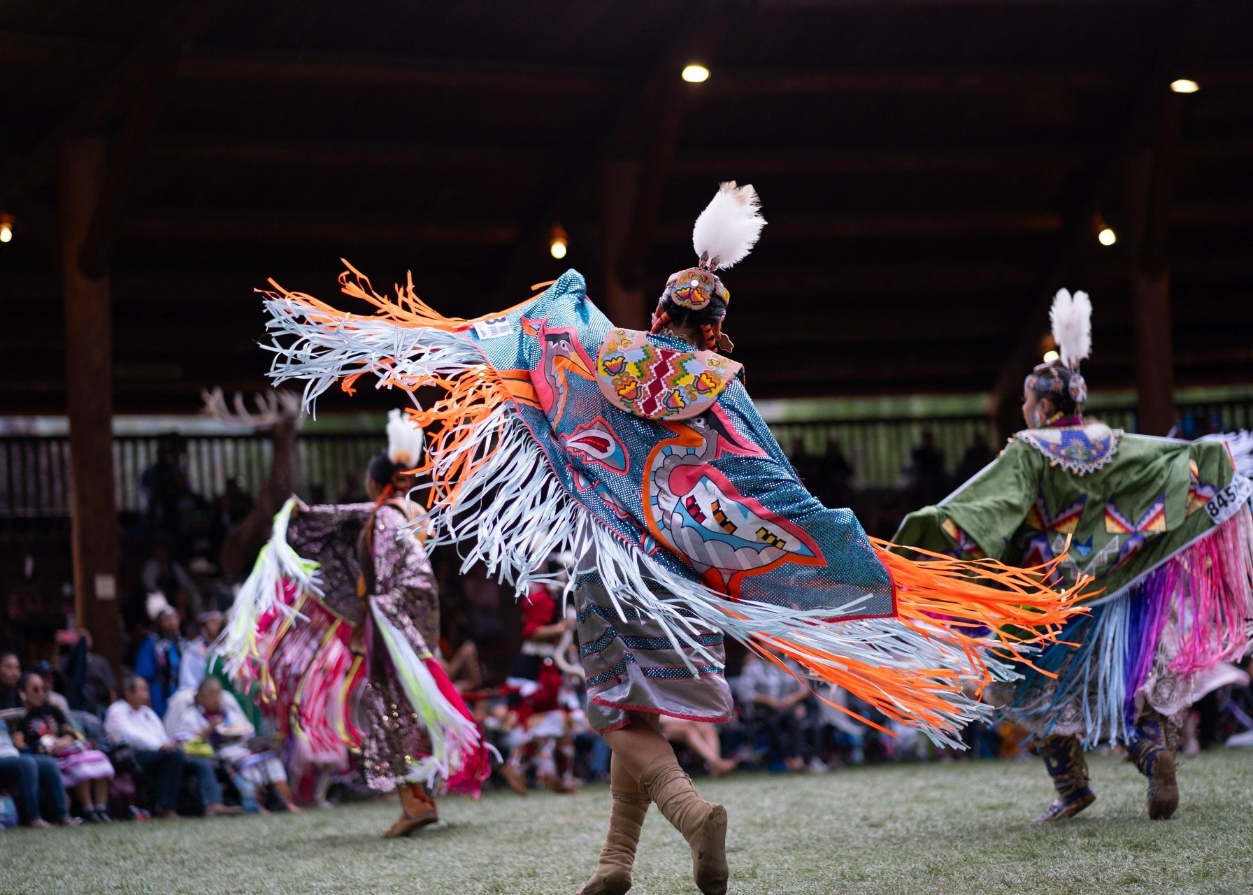 Dancer performing at the Kamloopa Powwow wearing traditional indigenous regalia, located at Tk̓emlúps te Secwépemc Powwow Arbour.