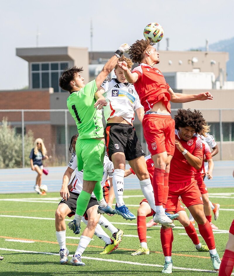 Player heads the soccer ball during the Kamloops International Cup.