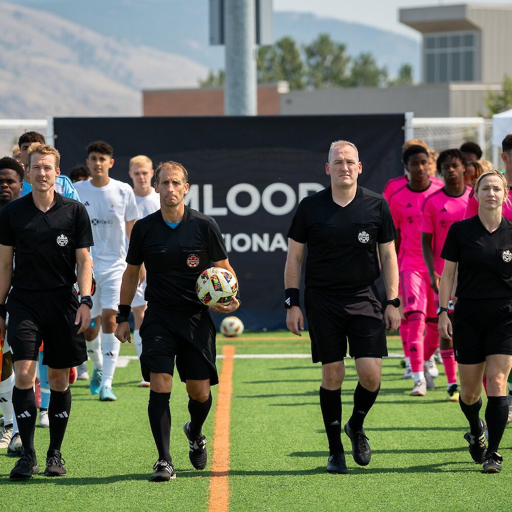 Teams playing in the Kamloops International Cup walking out onto the field at Hillside Stadium.