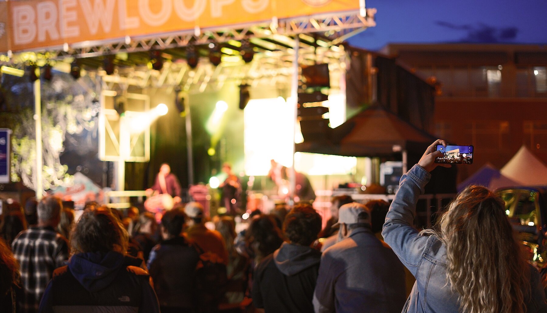 Tall beercan of the Room to Roam White IPA by Red Collar Brewing and Tourism Kamloops in the taproom at the brewery.