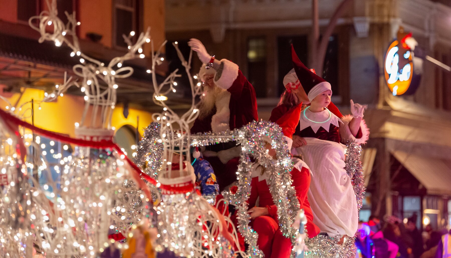 Visitors walking into the warmly light Sagebrush Theatre at night to attend a show in Kamloops, British Columbia.