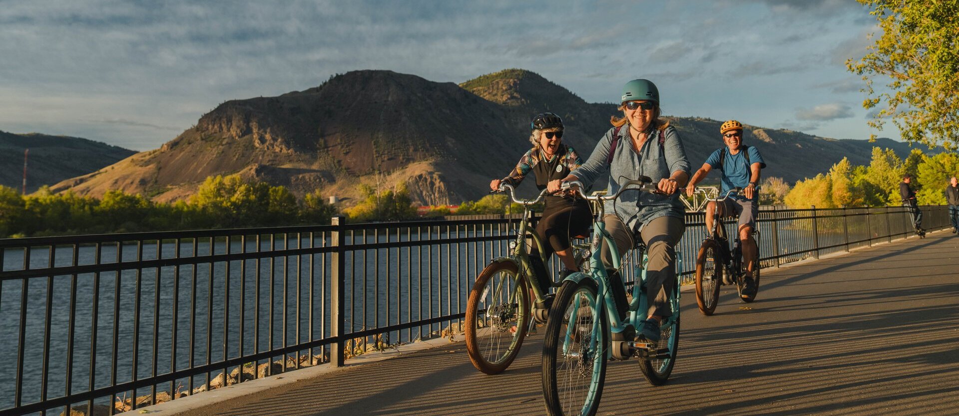 A trio of cyclists riding on the Rivers Trail in Riverside Park