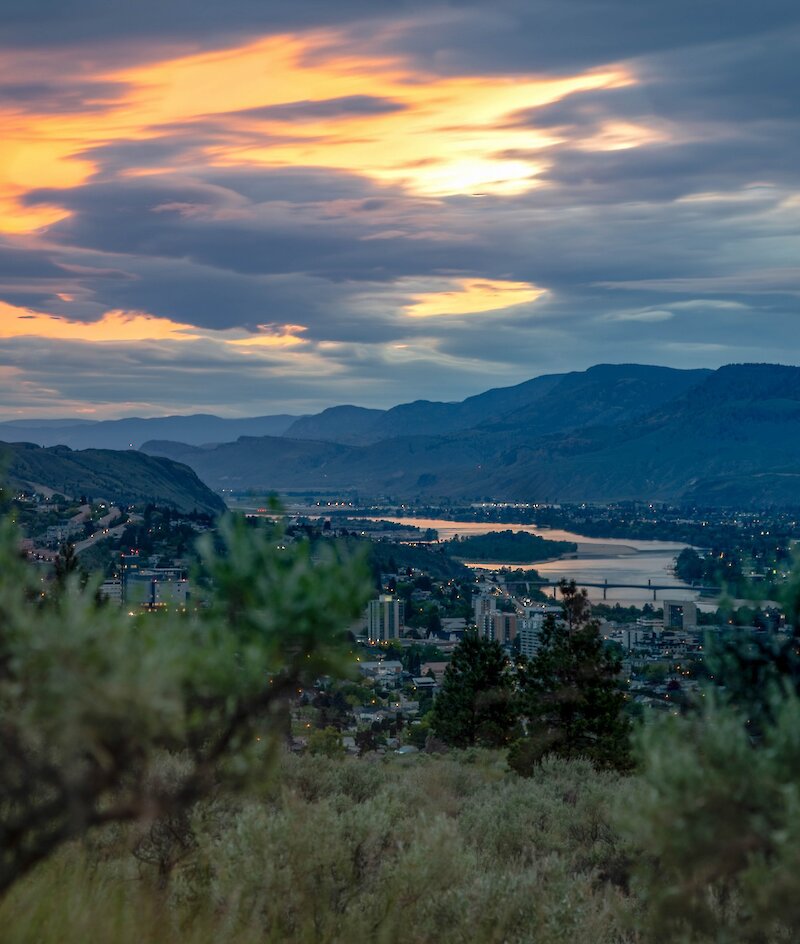 The colourful sunset over Kamloops with the snowy BC mountains in the background.