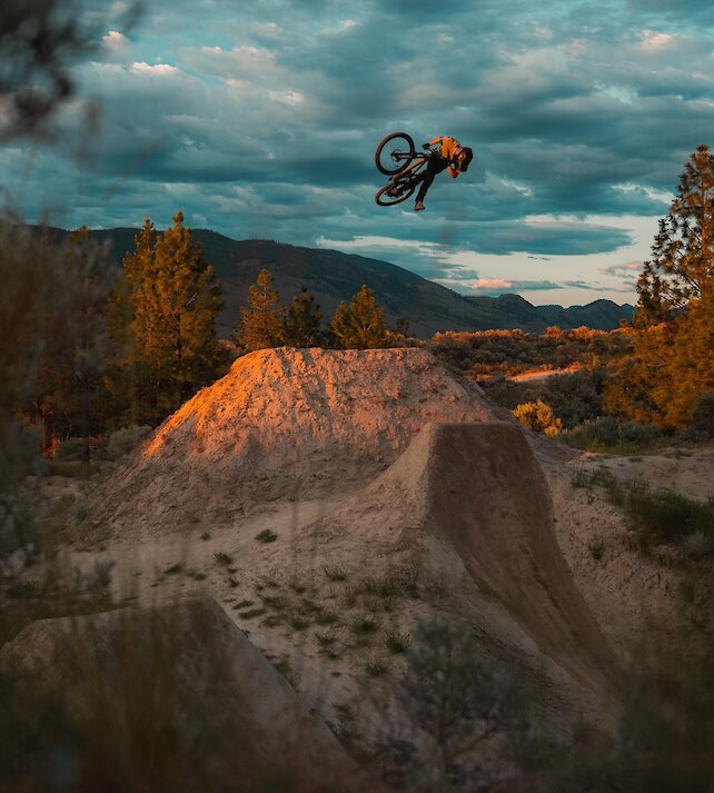 A mountain bike taking a dirt jump at The Bike Ranch in Kamloops, BC.