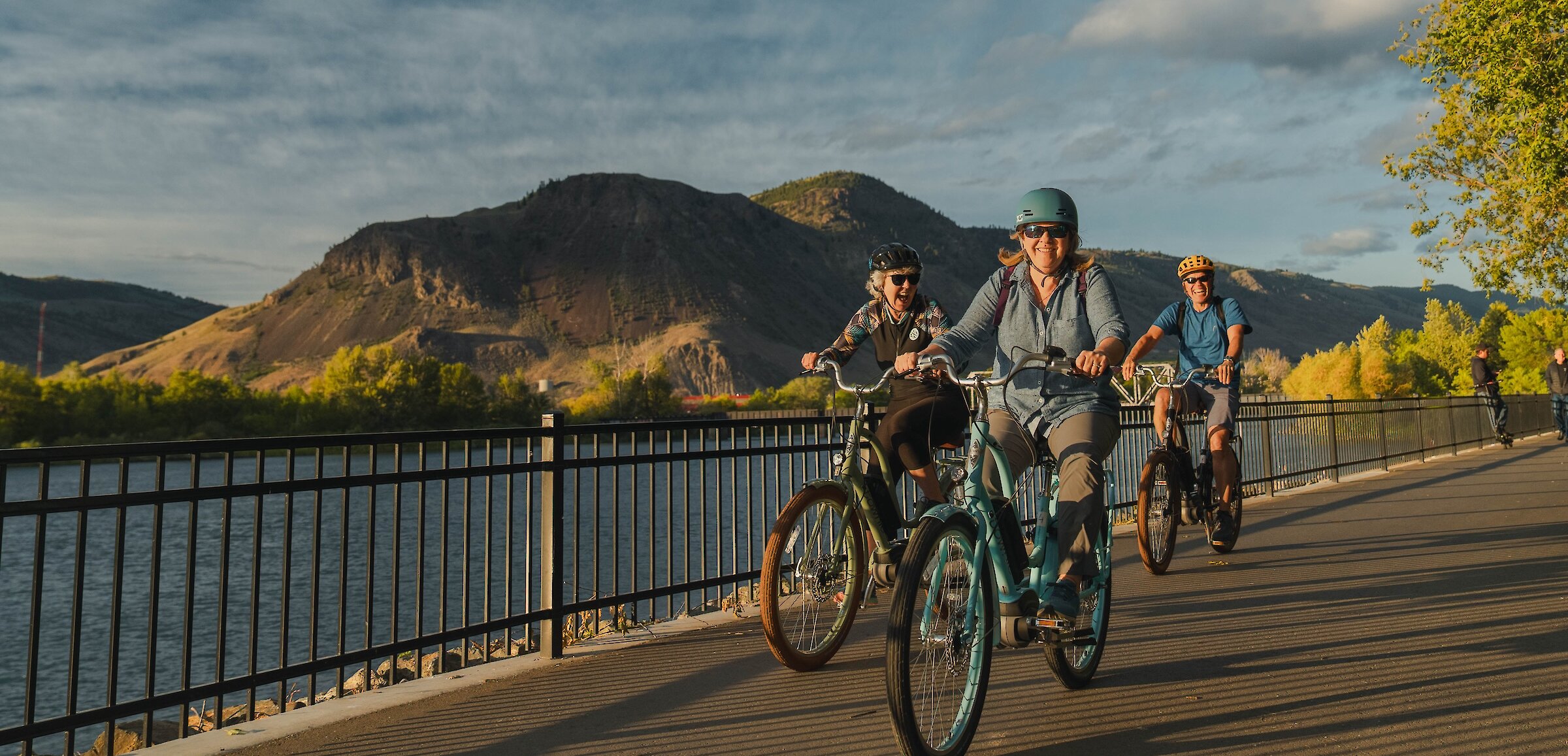 A Mother and son admiring the view over Kamloops Lake from a hiking viewpoint in Kamloops, BC.