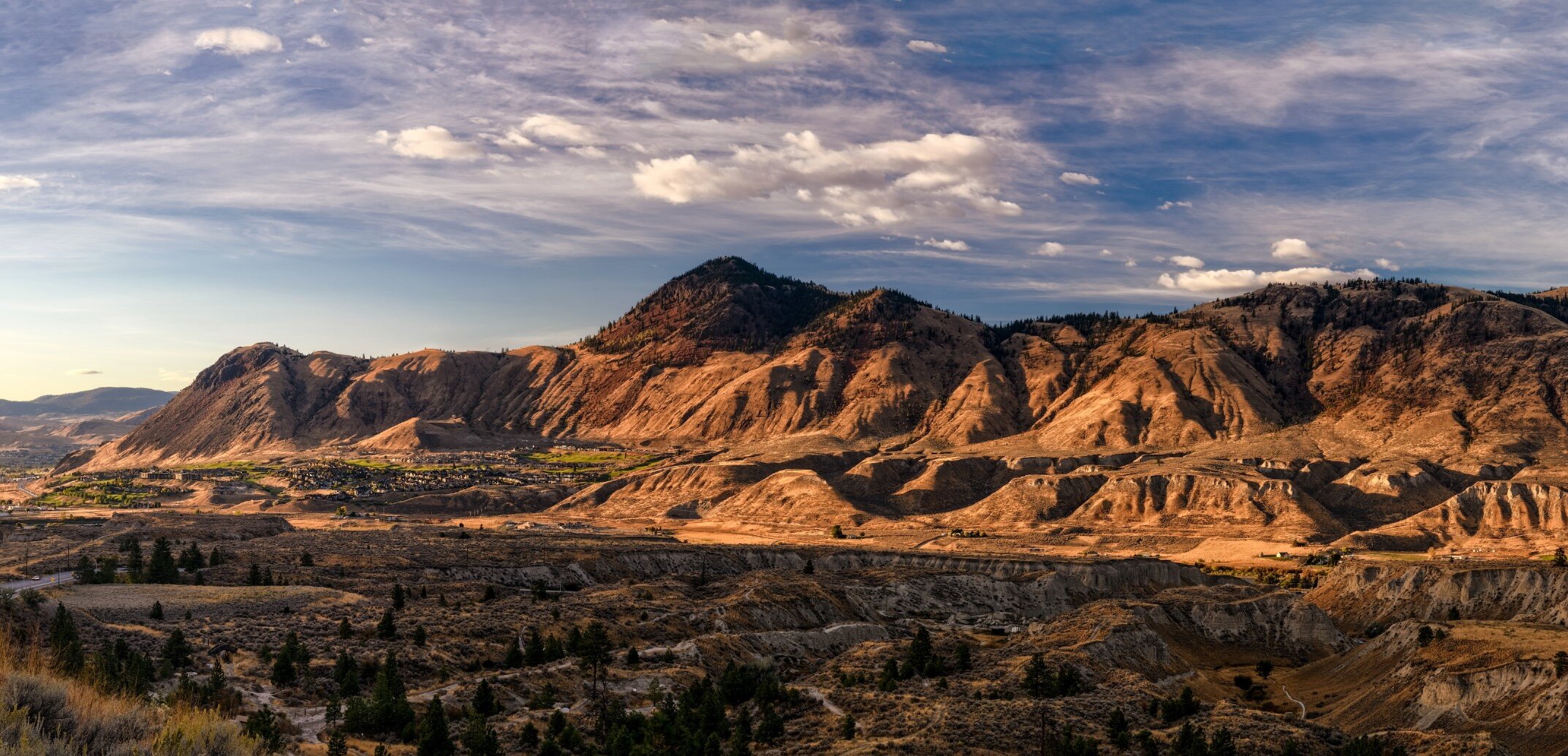 Mount Peter and Paul in Kamloops with the light hitting the BC mountain peaks.