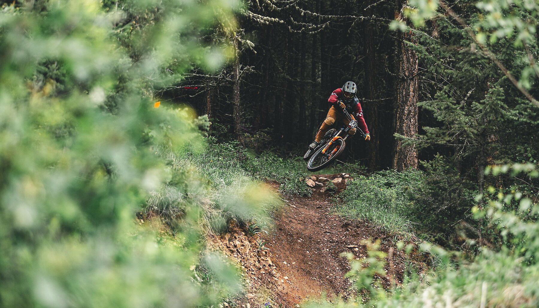 A rider gets air off a jump on their mountain bike at Harper Mountain near Kamloops BC