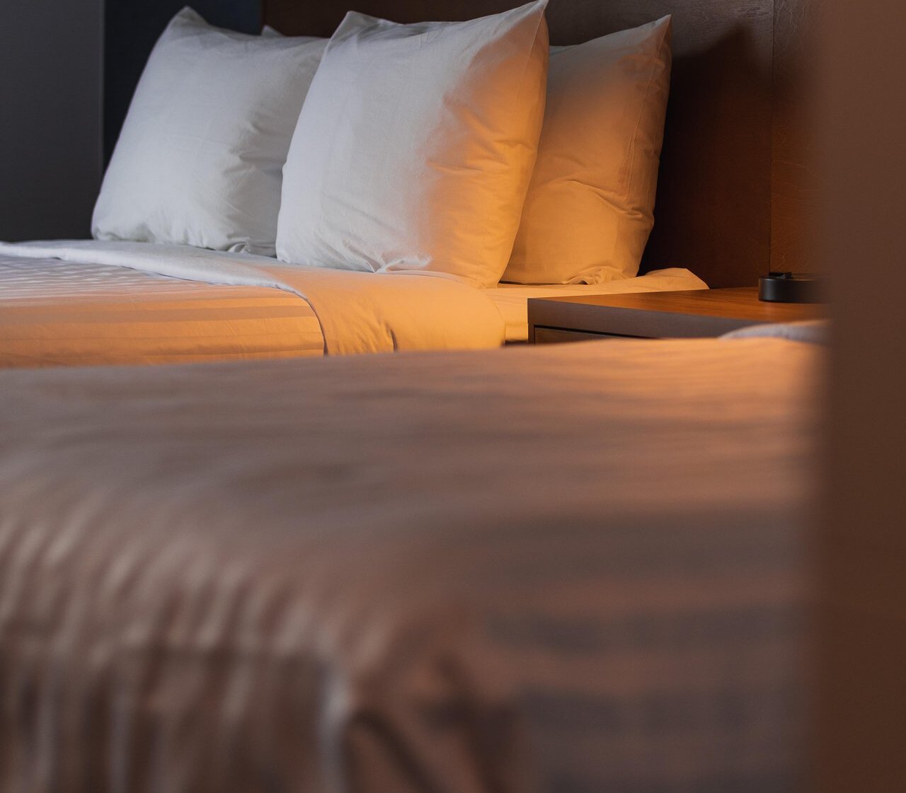 A neatly made hotel bed at the Prestige Kamloops Hotel.