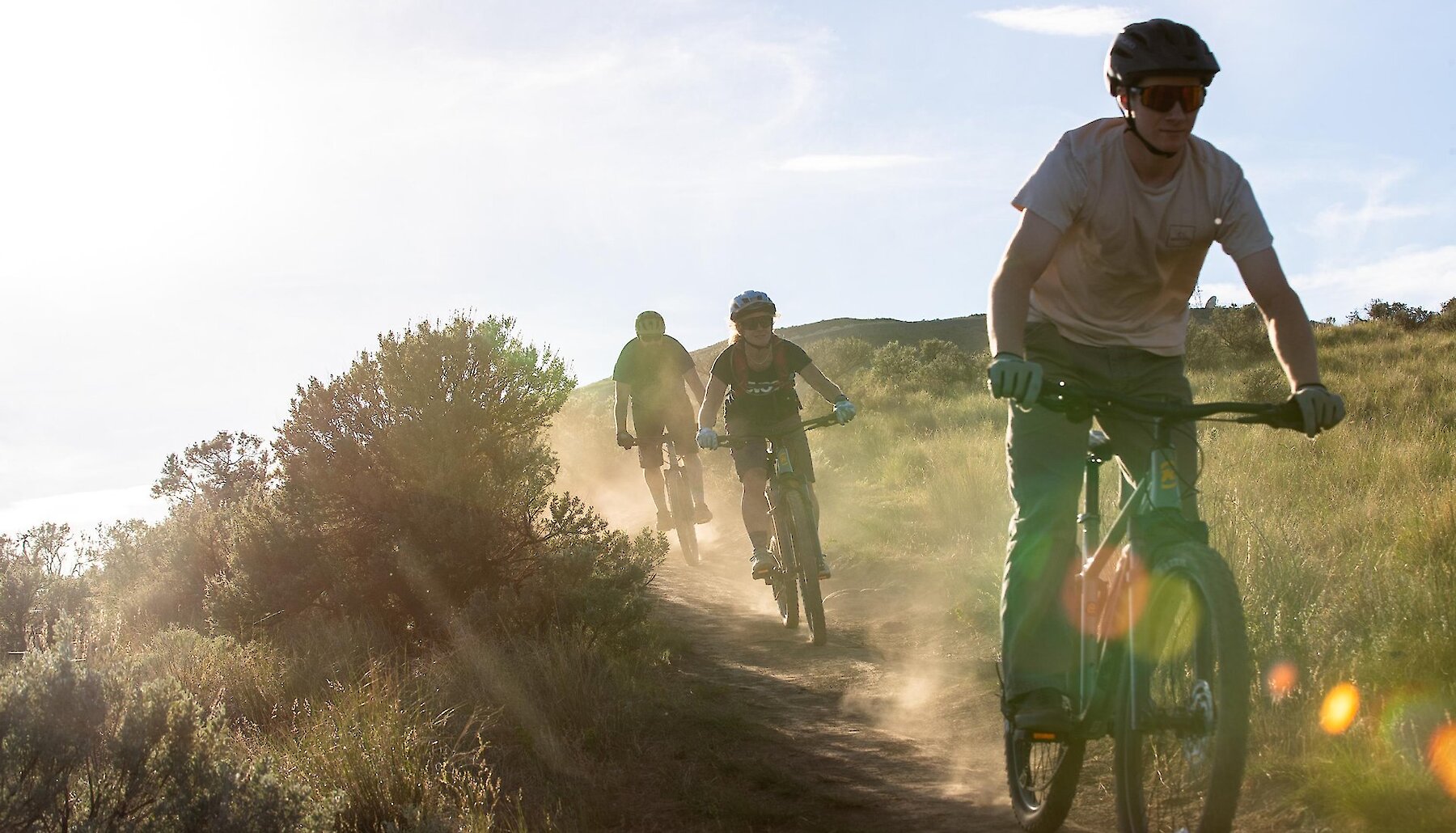 A group of bikers riding along the trail on a Guided Mountain Bike Tours with Adventuring Into Life in Kamloops, BC.