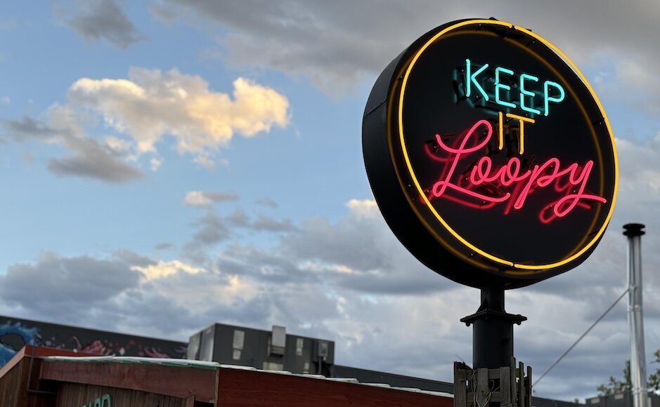 Neon Keep It Loopy sign, an Illuminate Kamloops Activation, perched above Red Beard Cafe on the North Shore in Kamloops, BC.