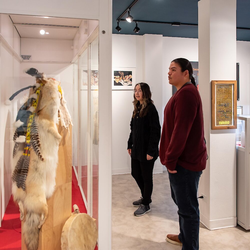 Museum visitors admiring the exhibit at the Secwépemc Museum in Tk̓emlúps te Secwépemc.