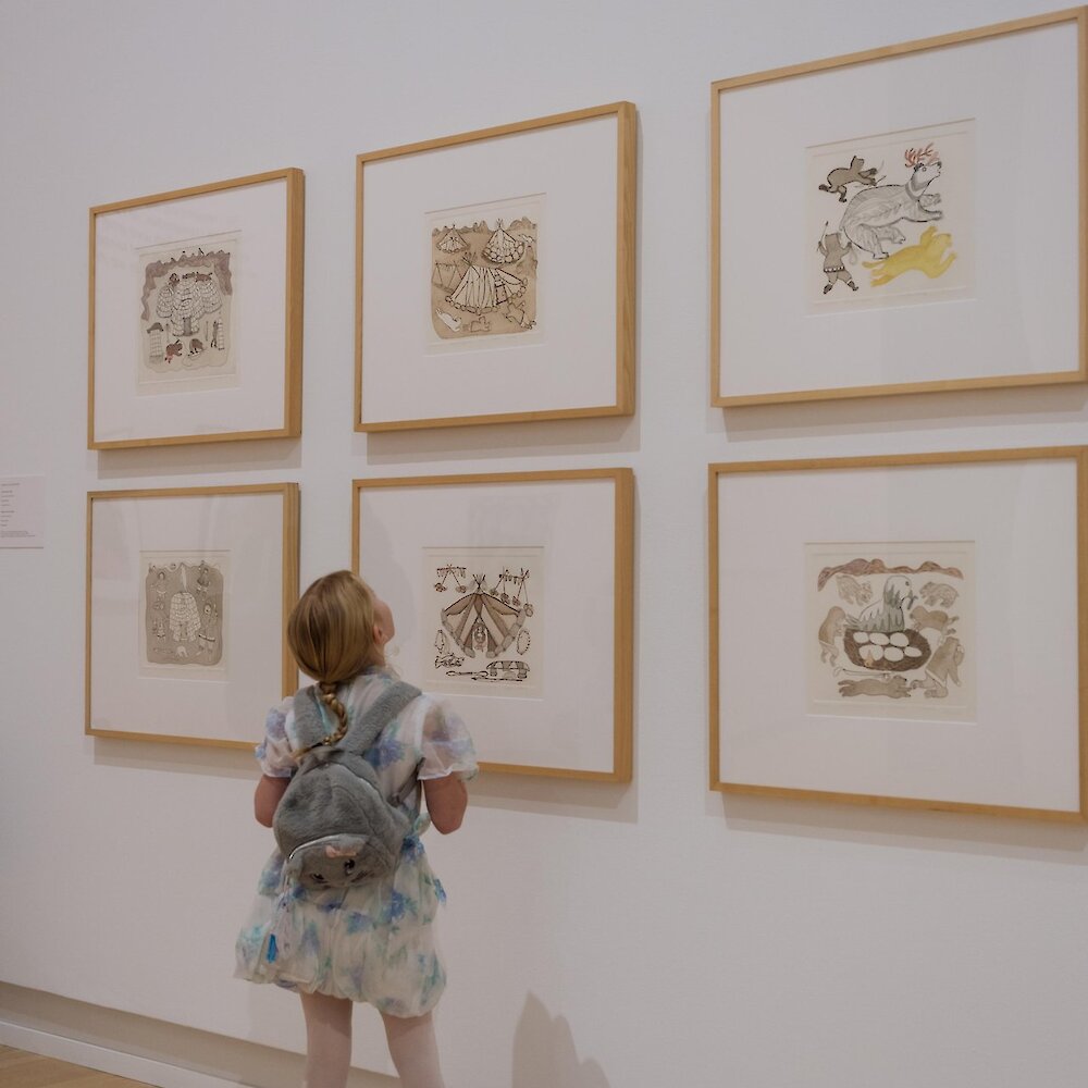 A child looks up at the Art exhibit at the Kamloops Art Gallery.