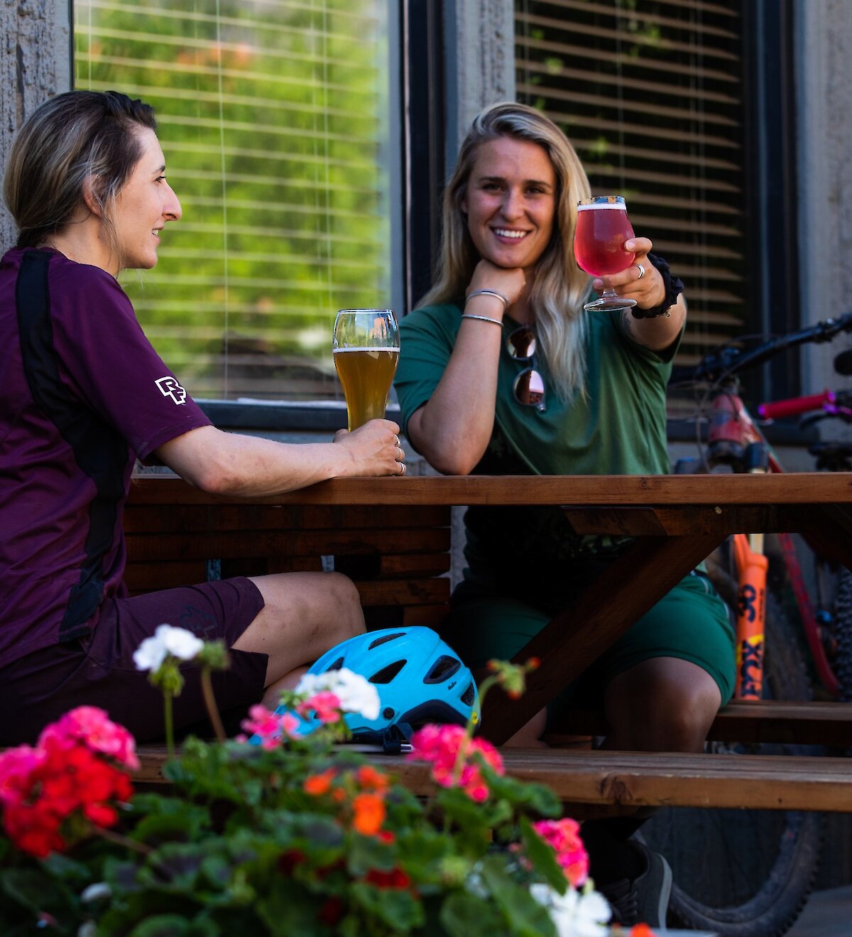 Two girls drinking beer on the patio at Red Collar Brewing in downtown Kamloops, BC.